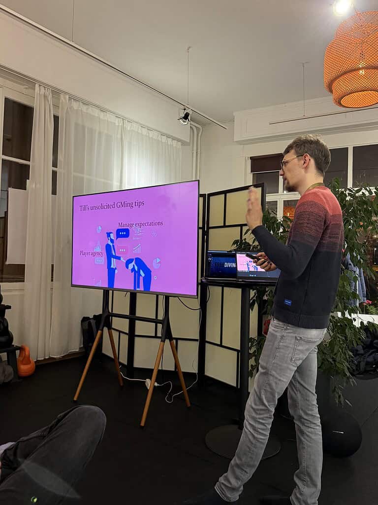 Man presenting at Coffeehouse Conference with screen displaying tips.