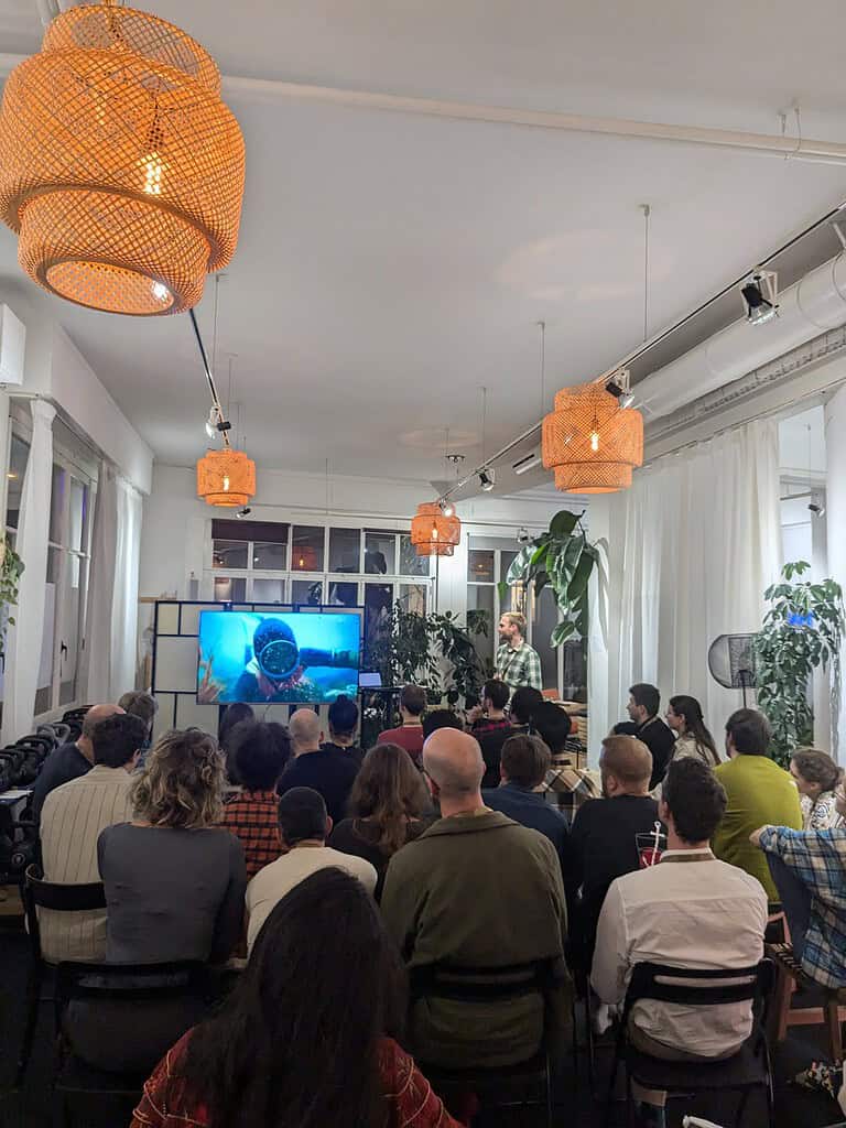 Audience attending a presentation at the Coffeehouse Conference in a well-lit, contemporary space.